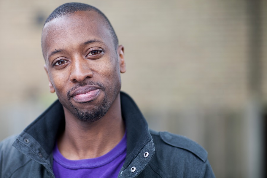 young male smiling at camera