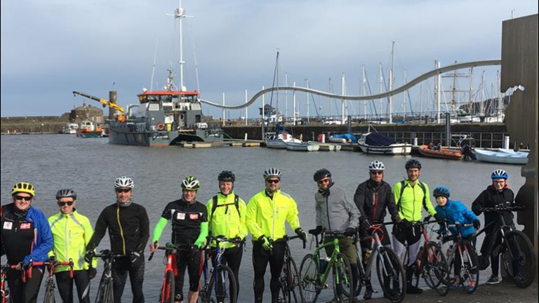 Group of fundraisers cycling