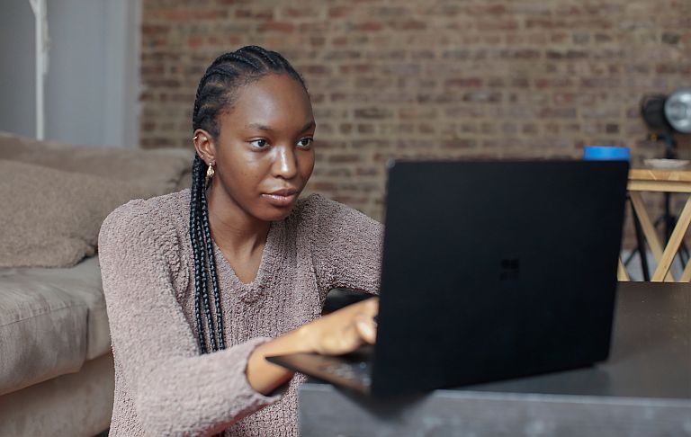 Person typing on a laptop