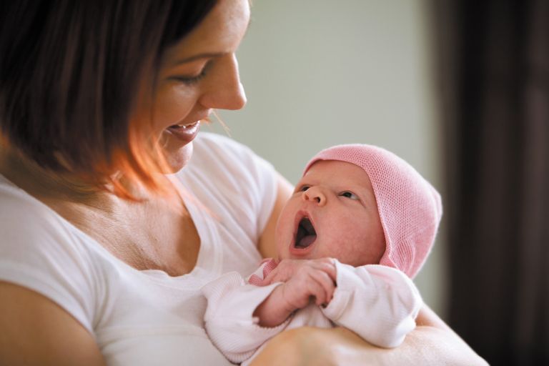 Smiling photo of mum and baby