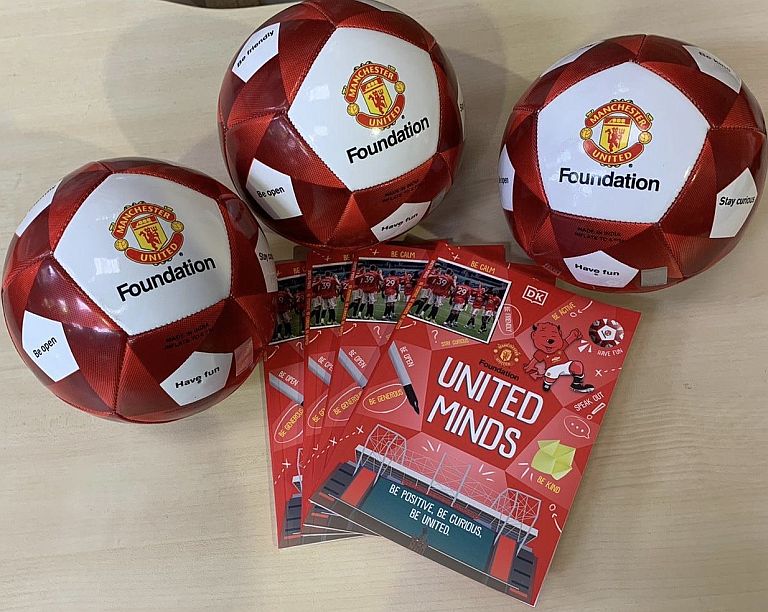 Manchester United Foundation footballs and booklets