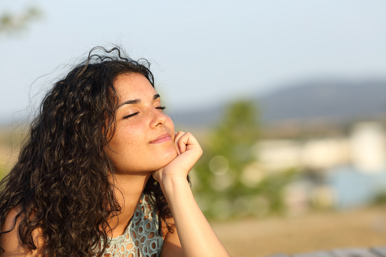 Person smiling in the sunshine