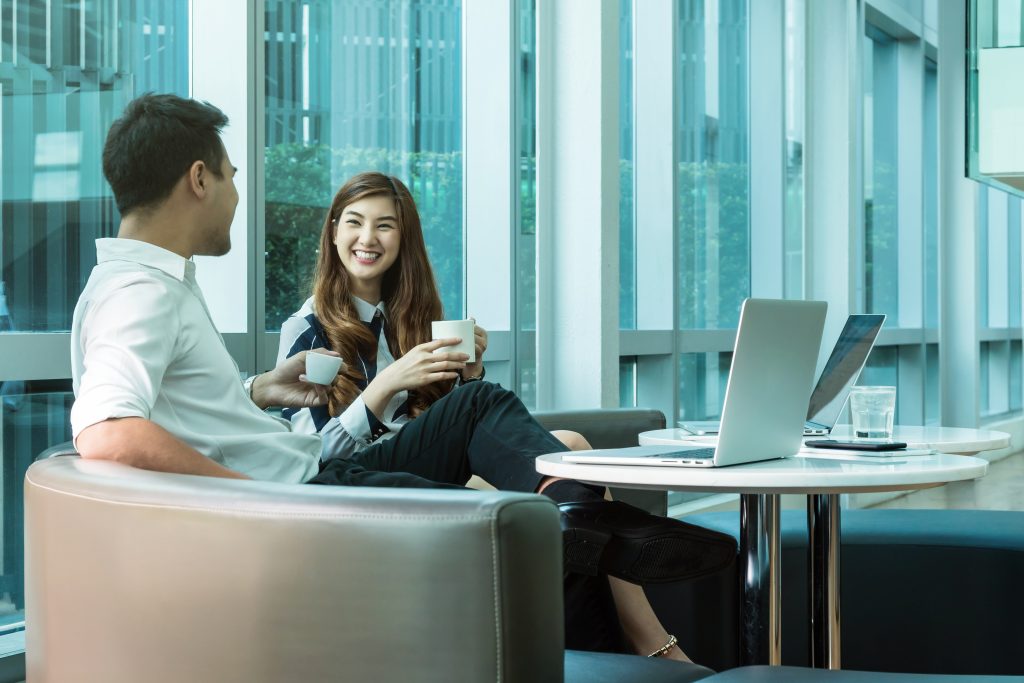 Colleagues chatting and working together