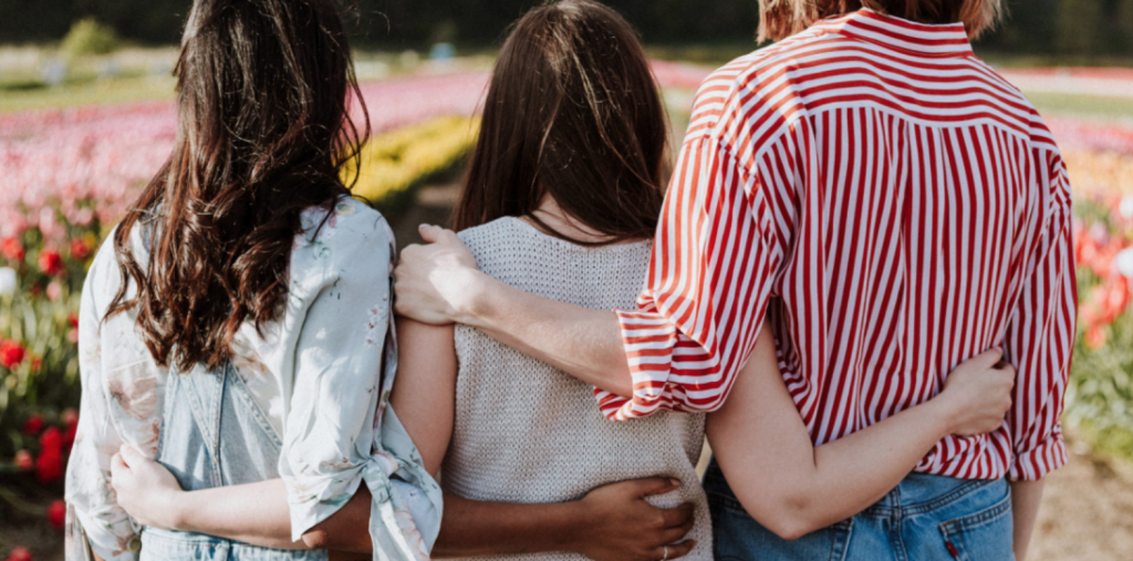 Friends embracing each other