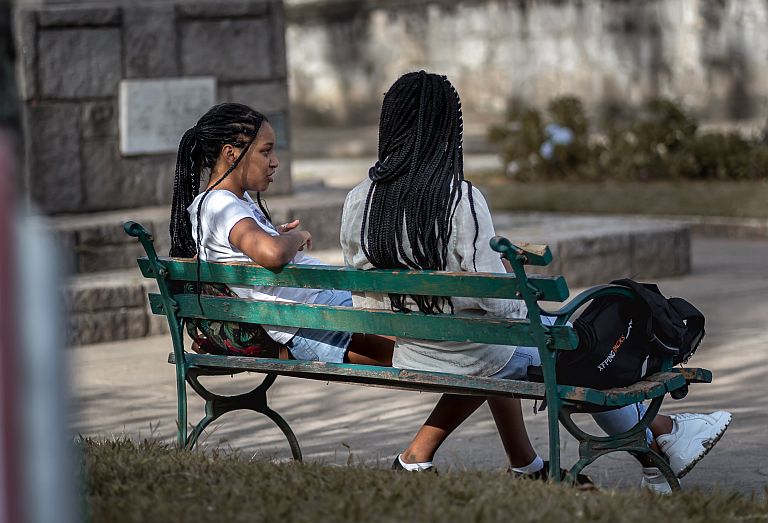 Friends chatting on a bench