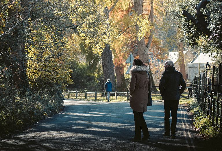 People walking together in Autumnal park