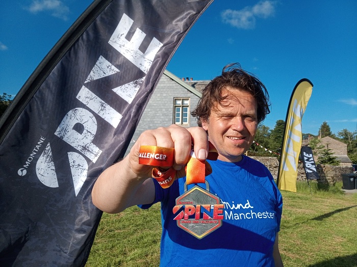 Fundraiser celebrating with his medal