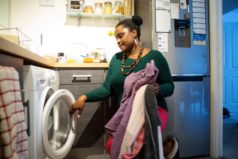 Person emptying washing machine