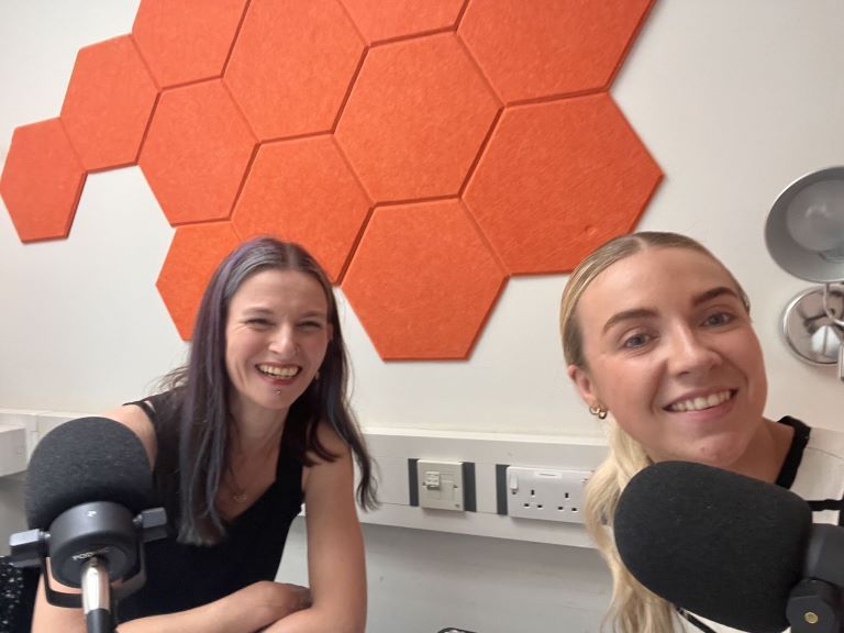 Sam and Lucy from Greater Manchester of Commerce in the podcast studio